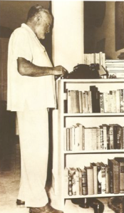 Ernest Hemingway at his stand up desk: typewriter perched atop dresser doors
